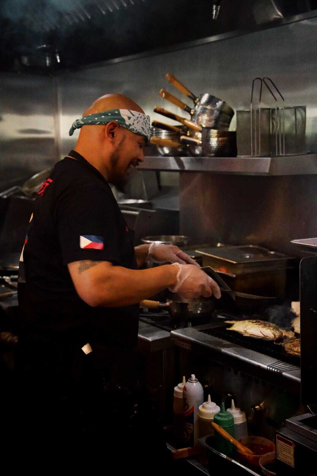 A Purple Roots chef cooking on the line